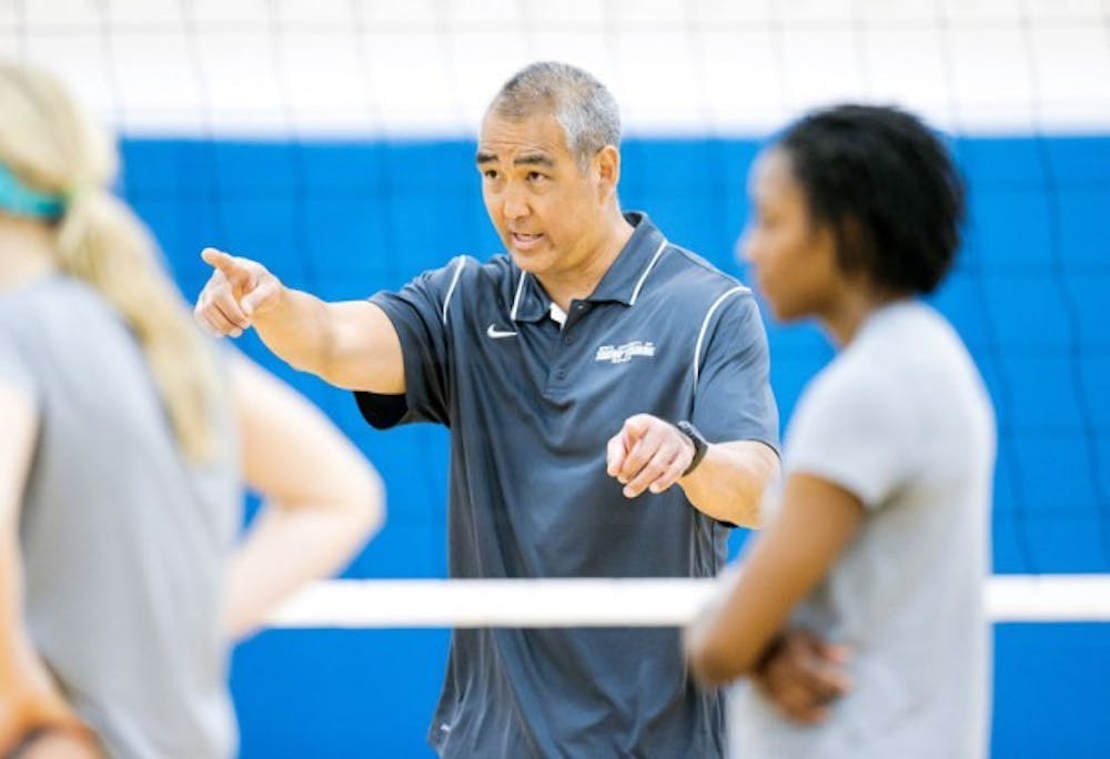 Reed Sunahara coaches a volleyball team practice during the spring season. A motorcycle accident during the height of his playing career hampered Sunahara&rsquo;s chances at making the U.S. Olympic team. But it helped start his coaching career as the new head coach of the Bulls.
Courtesy of Paul Hokanson, UB Athletics