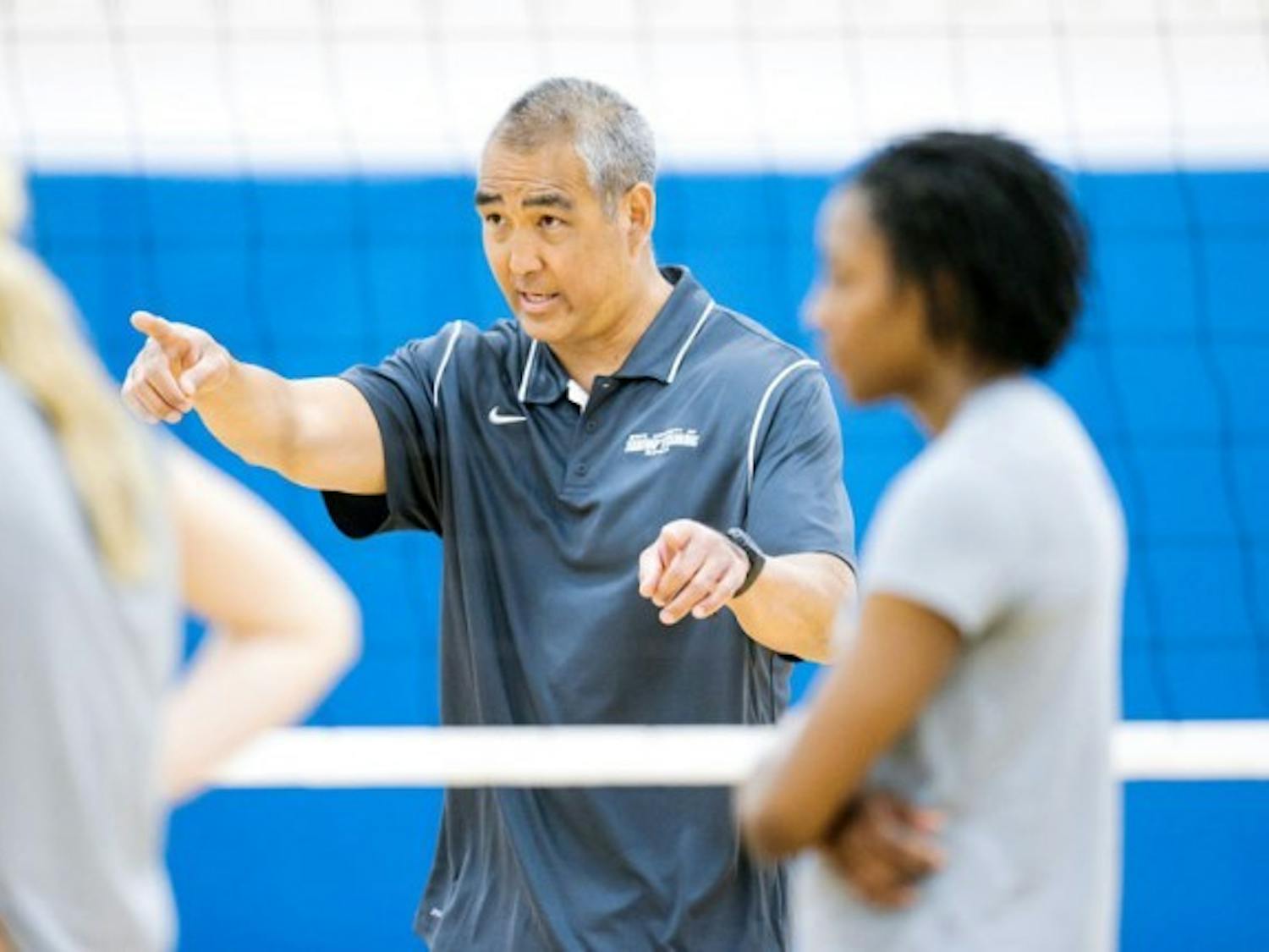 Reed Sunahara coaches a volleyball team practice during the spring season. A motorcycle accident during the height of his playing career hampered Sunahara&rsquo;s chances at making the U.S. Olympic team. But it helped start his coaching career as the new head coach of the Bulls.
Courtesy of Paul Hokanson, UB Athletics
