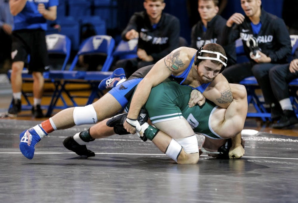 <p>Senior Joe Ariola controls his opponent in referee's position. Ariola's 11-3 win was Buffalo's only major decision of the day.</p>