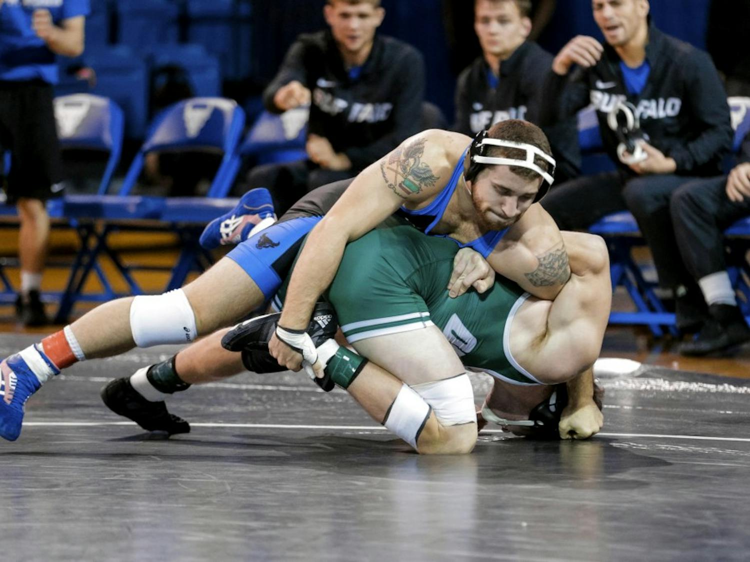 Senior Joe Ariola controls his opponent in referee's position. Ariola's 11-3 win was Buffalo's only major decision of the day.