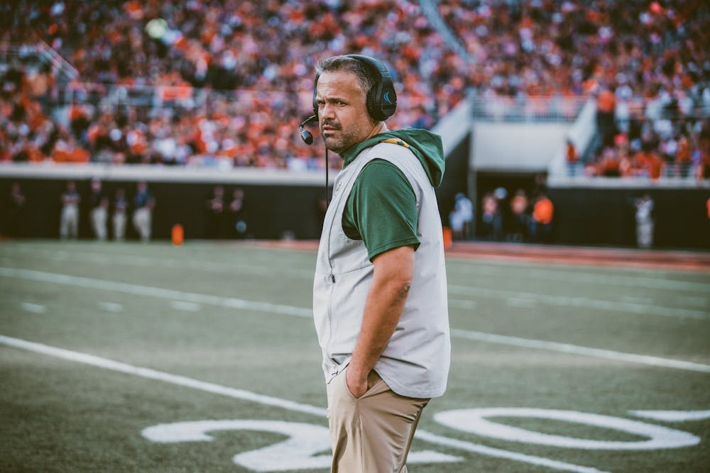 Baylor head coach Matt Rhule walks across the field