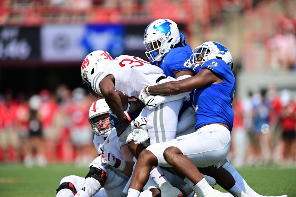 <p>Linebackers Kadofi Wright (2) and James Patterson (8) combine for a tackle in UB's 28-3 loss to Nebraska Saturday.</p>