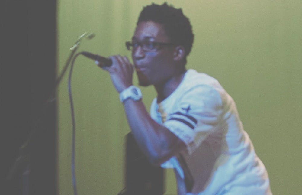 <p>Student rapper Marc Mighty performs at a show.</p>