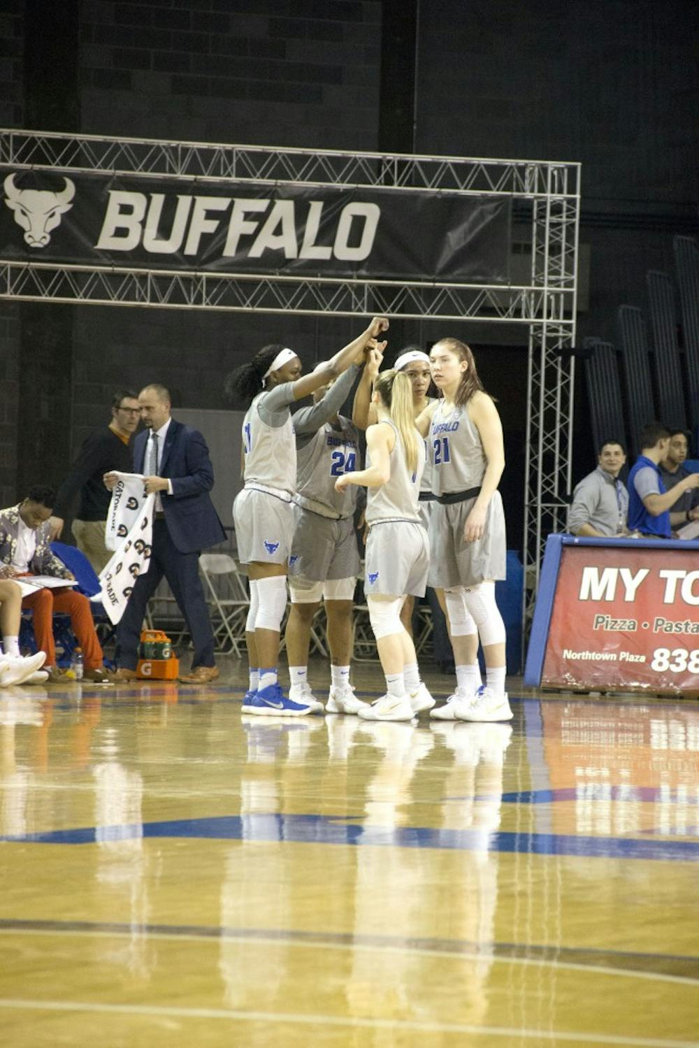 <p>The Bulls huddle during a game. The women's basketball team is looking to become MAC champions again this offseason.</p>