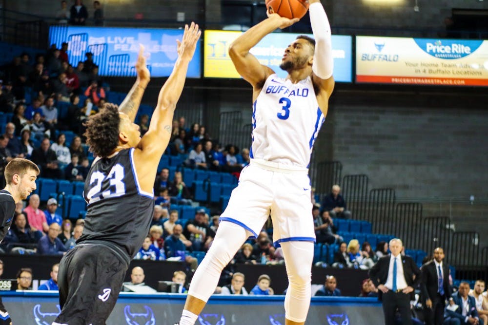 <p>Sophomore Guard Jayvon Graves takes a shot over a Daemen defender.</p>