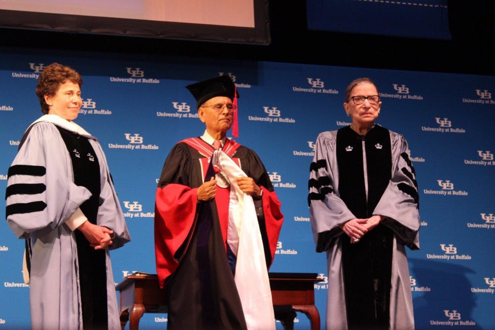 Associate Justice of the Supreme Court Ruth Bader Ginsburg (right) stands next to UB President Satish Tripathi and Acting Chairman of the SUNY Board of Trustees Merryl Tisch as she receives her honorary diploma from UB.