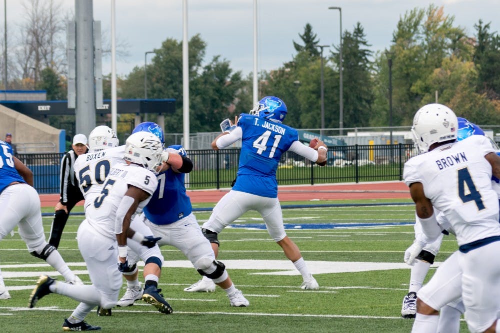 Junior quarterback Tyree Jackson winds up for the pass at UB Stadium. Jackson had 326 yards and 2 touchdowns in the 31-14 win against Toledo.&nbsp;