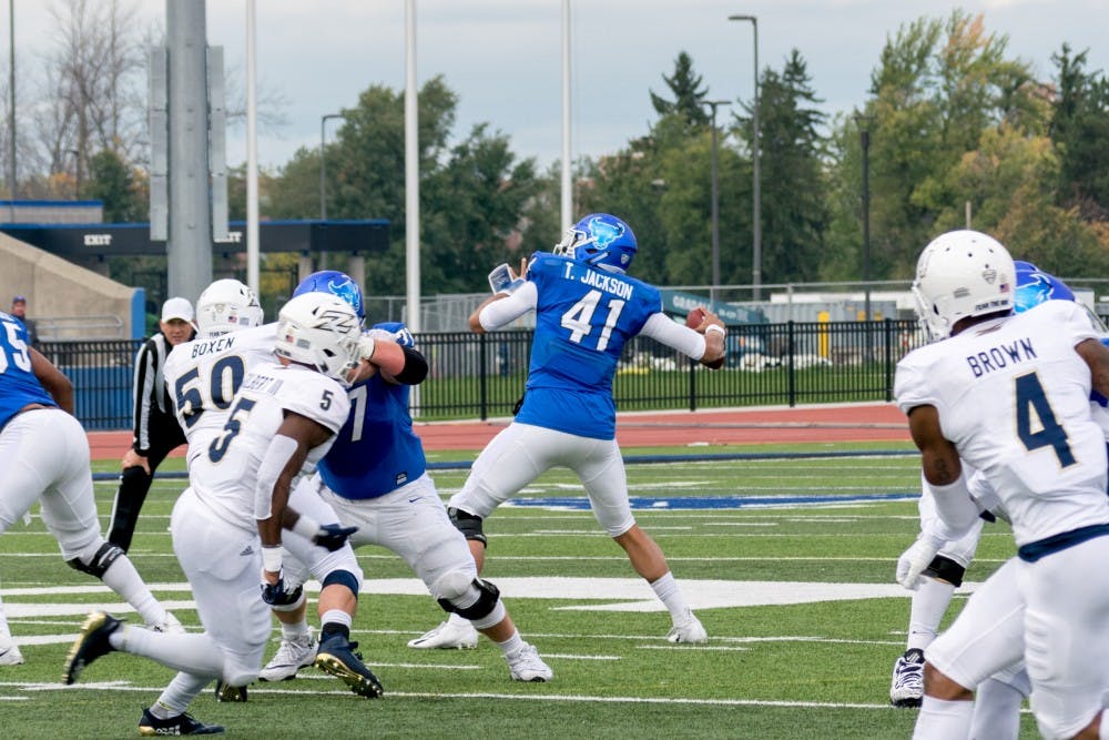 <p>Junior quarterback Tyree Jackson winds up for the pass at UB Stadium. Jackson had 326 yards and 2 touchdowns in the 31-14 win against Toledo.&nbsp;</p>