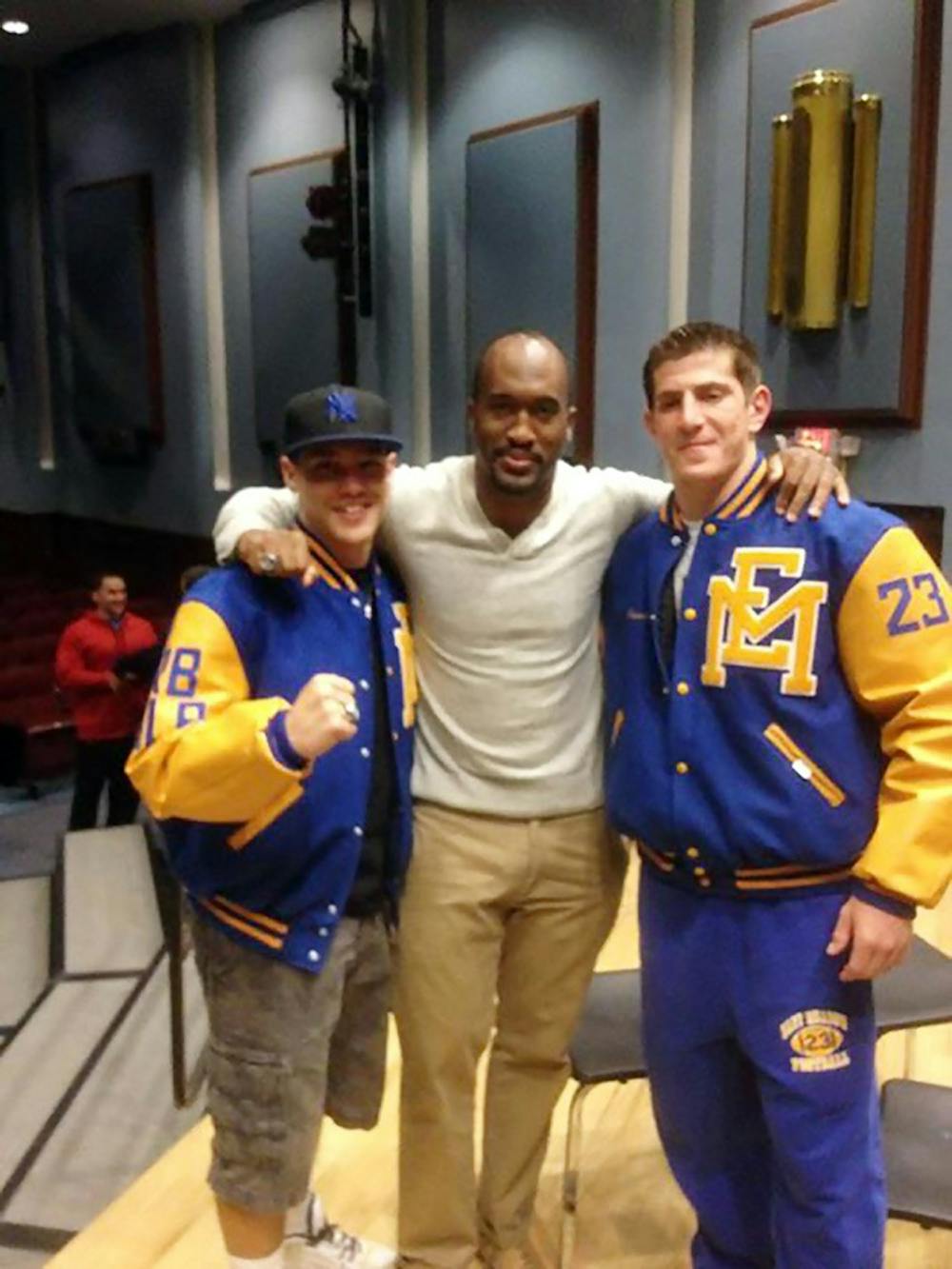 <p>Steven King (middle) poses with Andrew Lynch (left) and Evan Pantofel (right) while donning East Meadow lettermen jackets.</p>