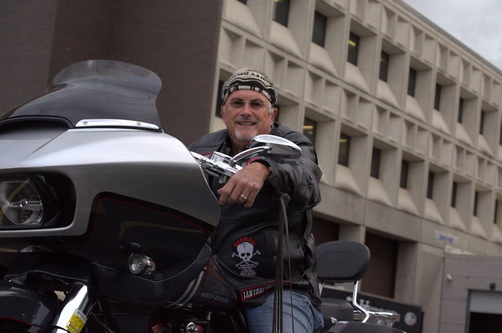 As a member of Bikers Against Child Abuse, Caribe provides comfort, safety and support for abused children. 