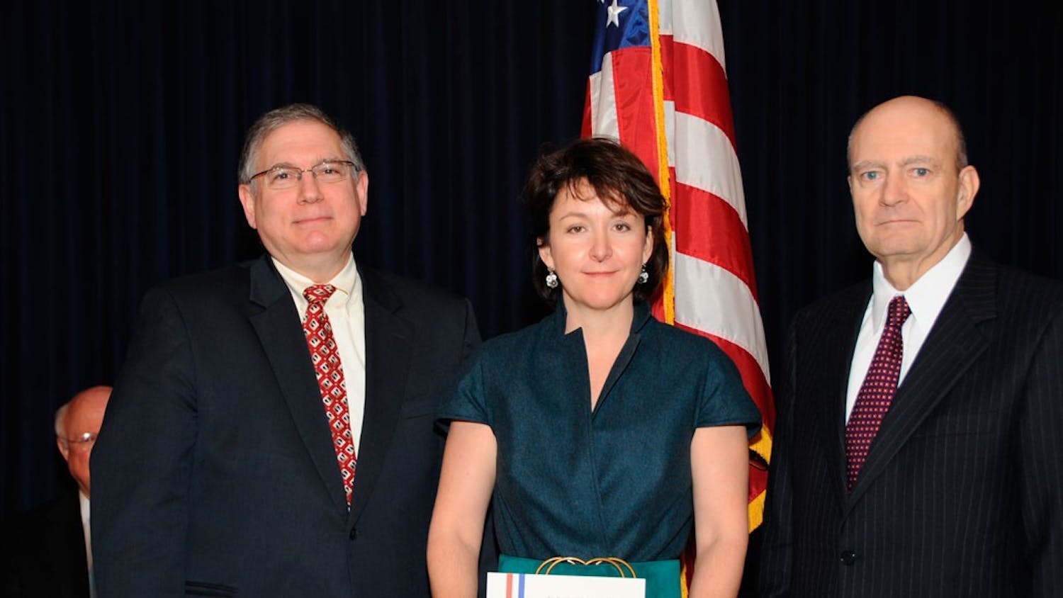 Lawrence Tabak (left) and Amy Heimberger (middle) pose for a photo in 2007.