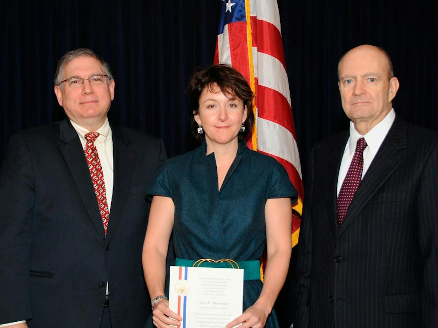 Lawrence Tabak (left) and Amy Heimberger (middle) pose for a photo in 2007.