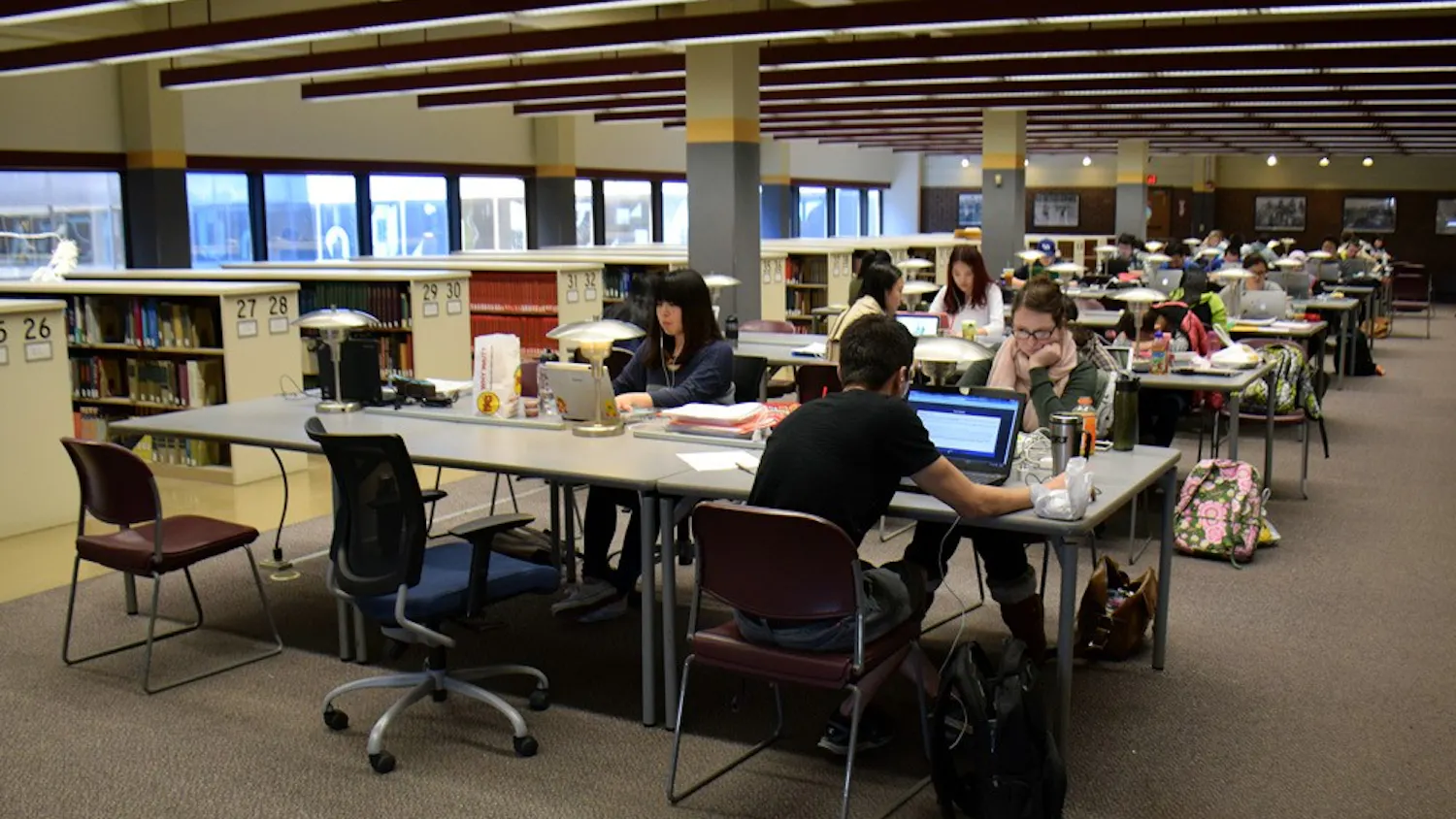 Students volunteering or performing community service serve as escorts for Sub Board I Inc.’s safety walks program. Escorts carry walkie-talkies and flashlights and wear brightly colored vests to ensure the most safe experience for students leaving Lockwood Library - UB’s 24-hour library - late at night.