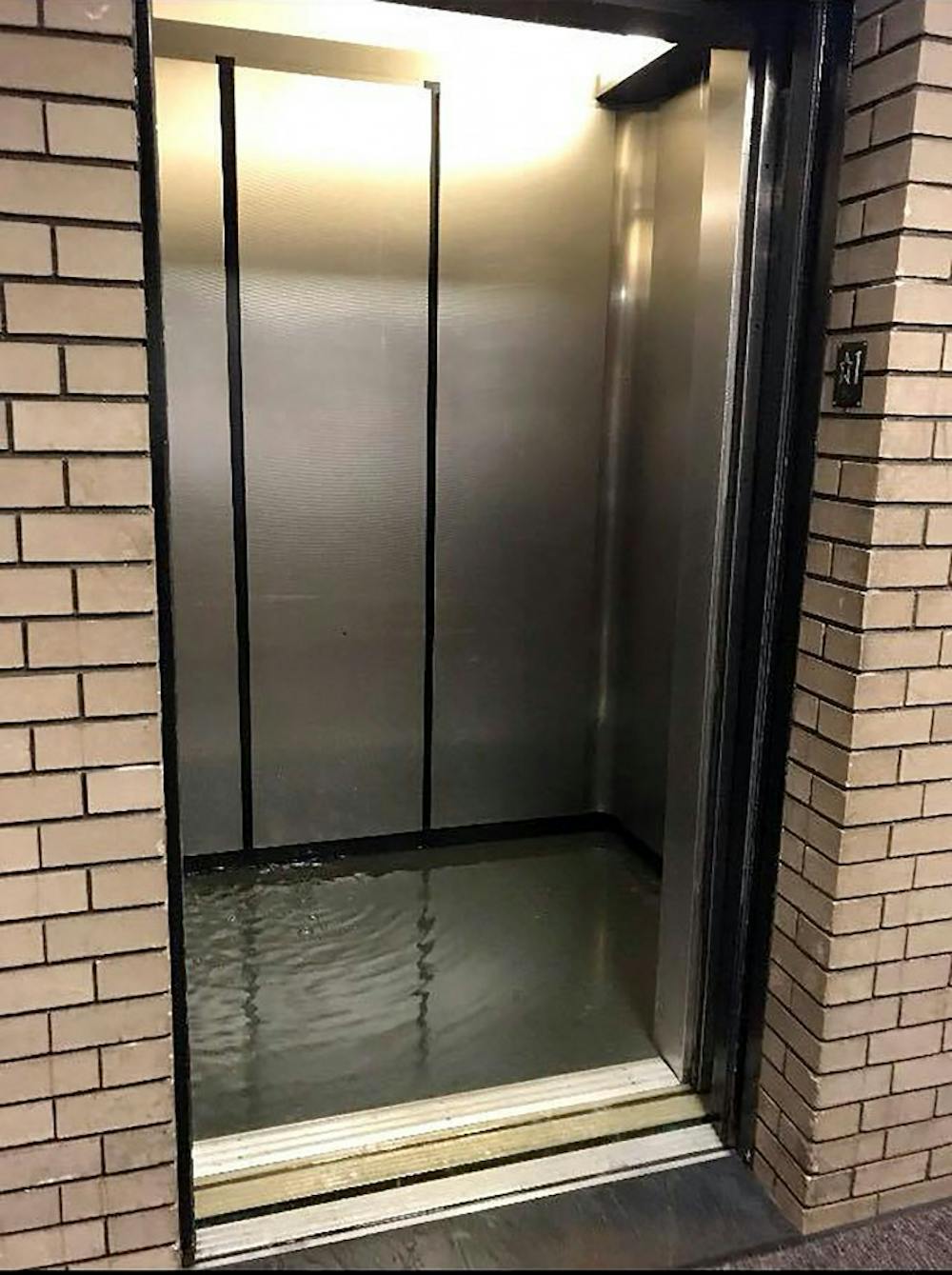 <p>An elevator in Clemens hall is filled with water. The flooding was a result of a burst water valve on the fourth floor cooling system.&nbsp; </p>