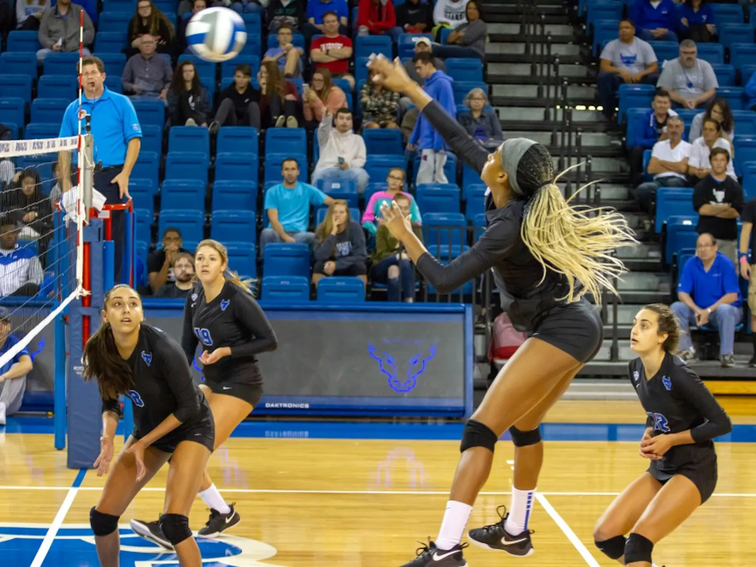 Junior outside hitter Rachel Sanks spikes the ball over the net. The Bulls won both games over the weekend including a five set come from behind win over the Northern Illinois Huskies