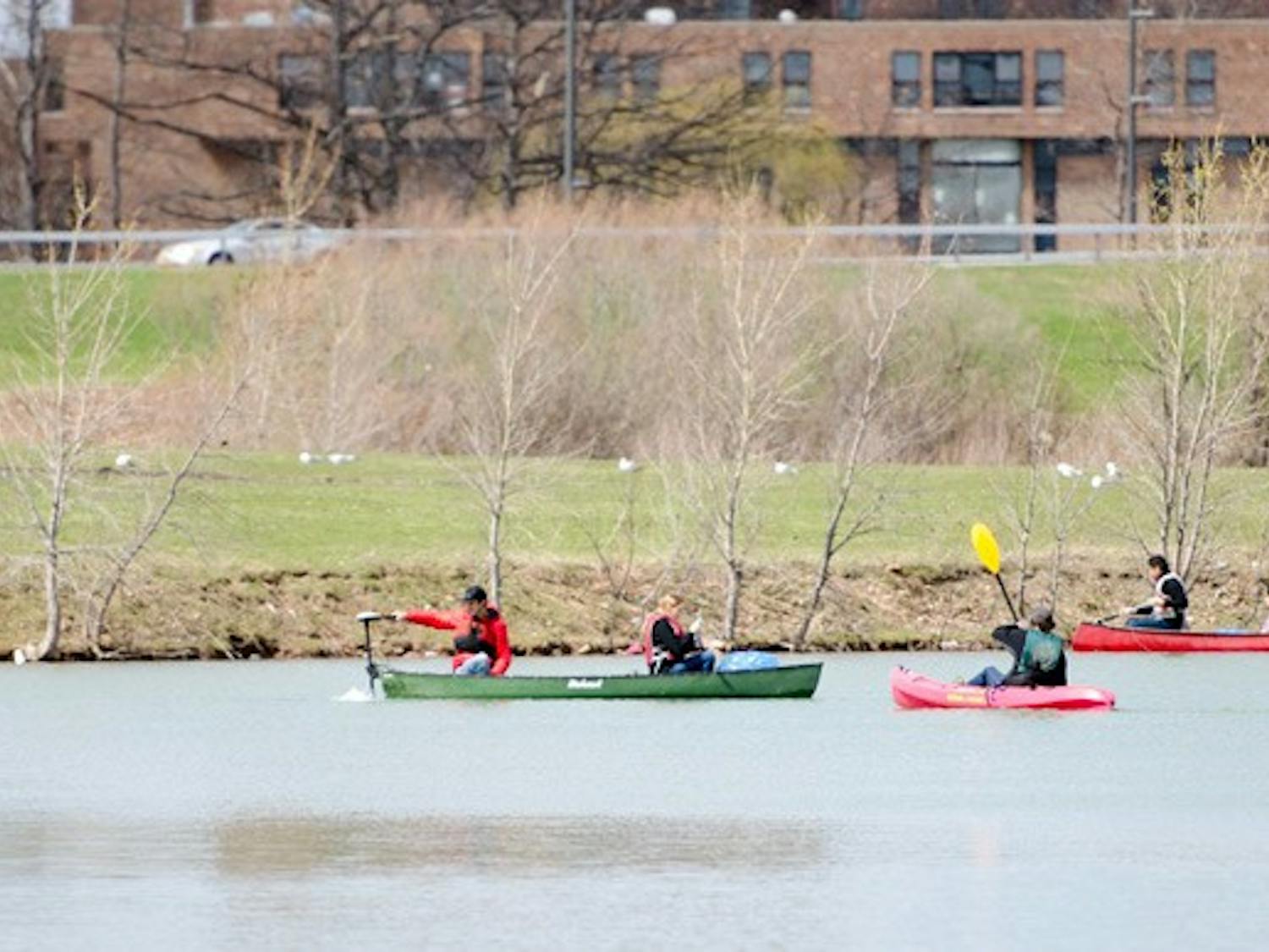 Students from the Outdoor Adventure club and volunteers were able to use kayaks and canoes for the first time to clean up parts of Lake LaSalle's shoreline that were inaccessible by land.