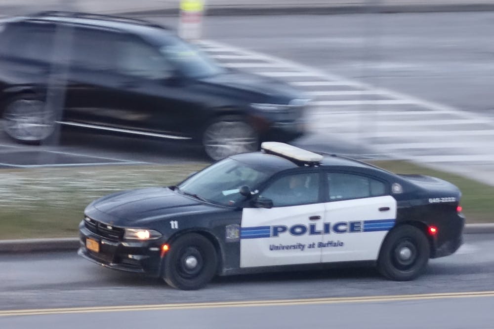 A University Police car passes the University Metro Rail station on South Campus on Wednesday, Dec. 6, 2023.