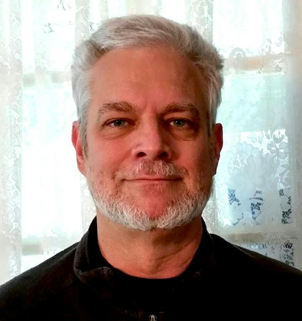 Middle-aged_man_with_gray_hair_and_beard.jpg