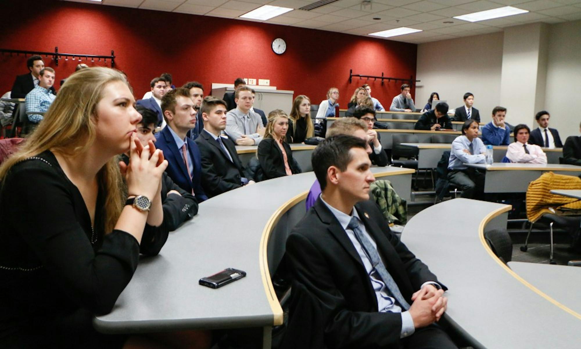 Students attend a Badger Consulting meeting, where they work with local businesses to improve their professional skills.