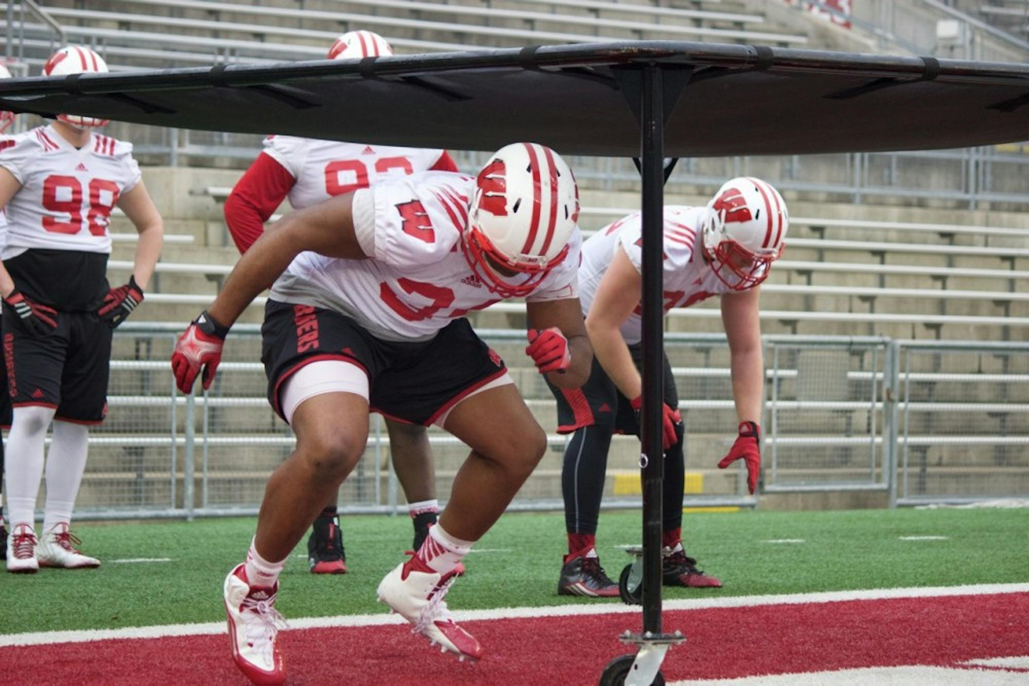 Wisconsin's defensive line runs through drills at a recent spring practice at Camp Randall Stadium.&nbsp;