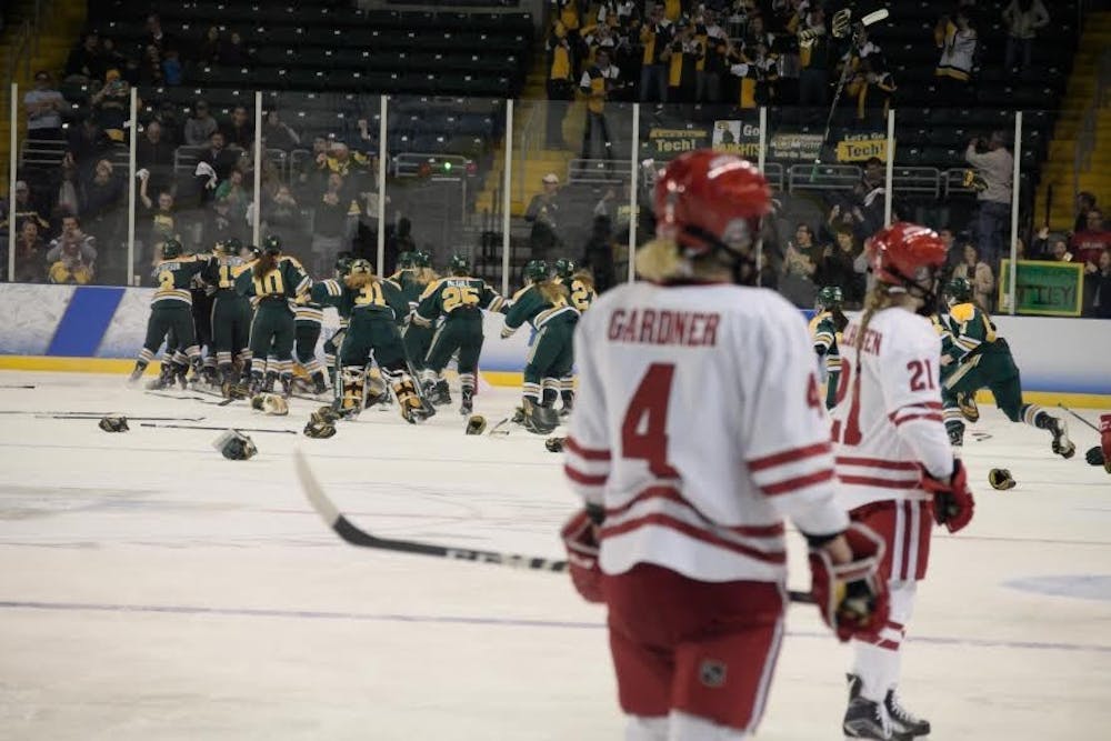 The Wisconsin Badgers fell one win short of capturing their fifth national title in program history.&nbsp;The Clarkson Knights celebrate their championship in the background as the horn sounds.&nbsp;