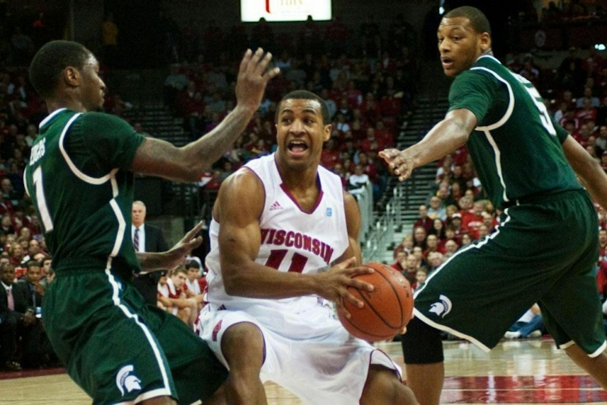 Taylor's career day leads the way for Wisconsin's big victory over Spartans