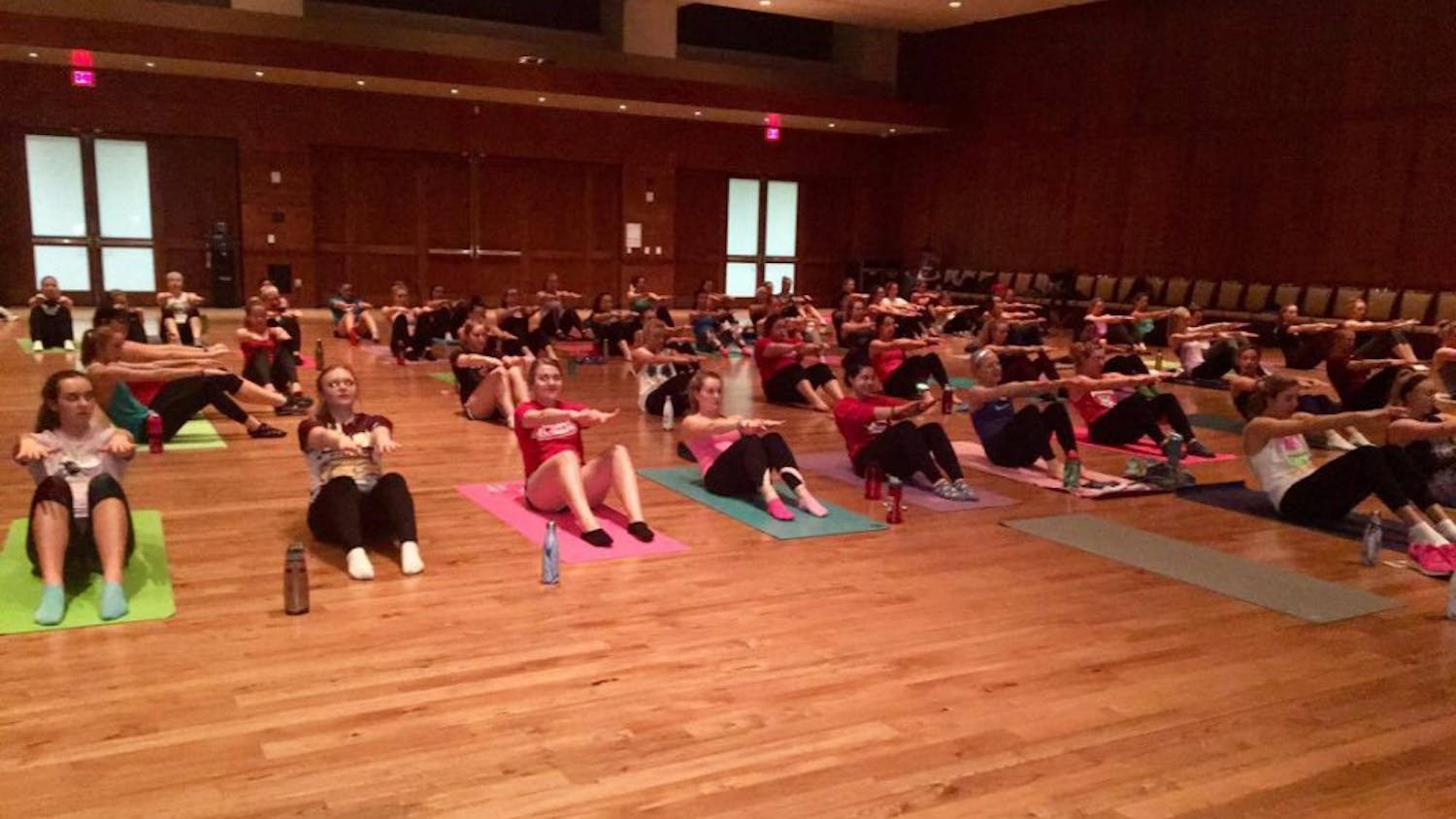 Members of the all-woman lifestyle student organization Changing Health, Attitudes, Actions to Recreate Girls at UW-Madison workout during a weekly session, which are either taught by a member of the group’s executive staff or an instruction from a local fitness studio.