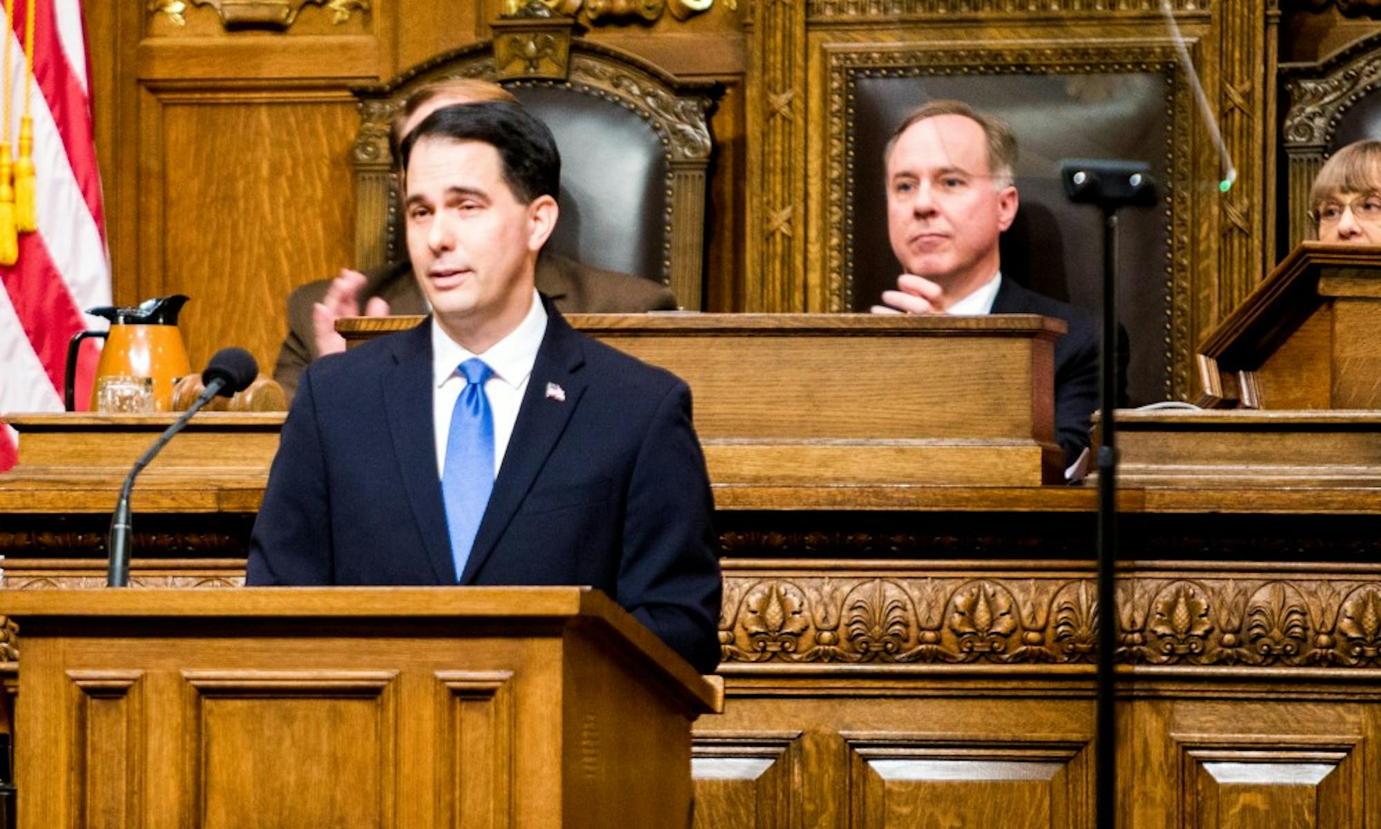 Gov. Scott Walker and Assembly Speaker Robin Vos, R-Rochester, disagree over whether to raise gas taxes and vehicle fees or borrow a half billion dollars for road and highway projects.