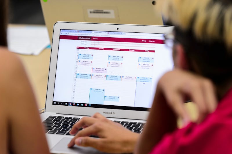 At right, a College of Engineering student-peer advisor works with an incoming first-year undergraduate to register for her classes using a laptop computer during a Student Orientation, Advising and Registration (SOAR) session at College Library in Helen C. White Hall at the University of Wisconsin-Madison on Aug. 9, 2017. Sponsored by the Center for the First-Year Experience, the two-day SOAR sessions provide new students and their parents and guests an opportunity to meet with staff and advisors, register for classes, stay in a residence hall, take a campus tour and learn about campus resources. (Photo by Jeff Miller / UW-Madison)