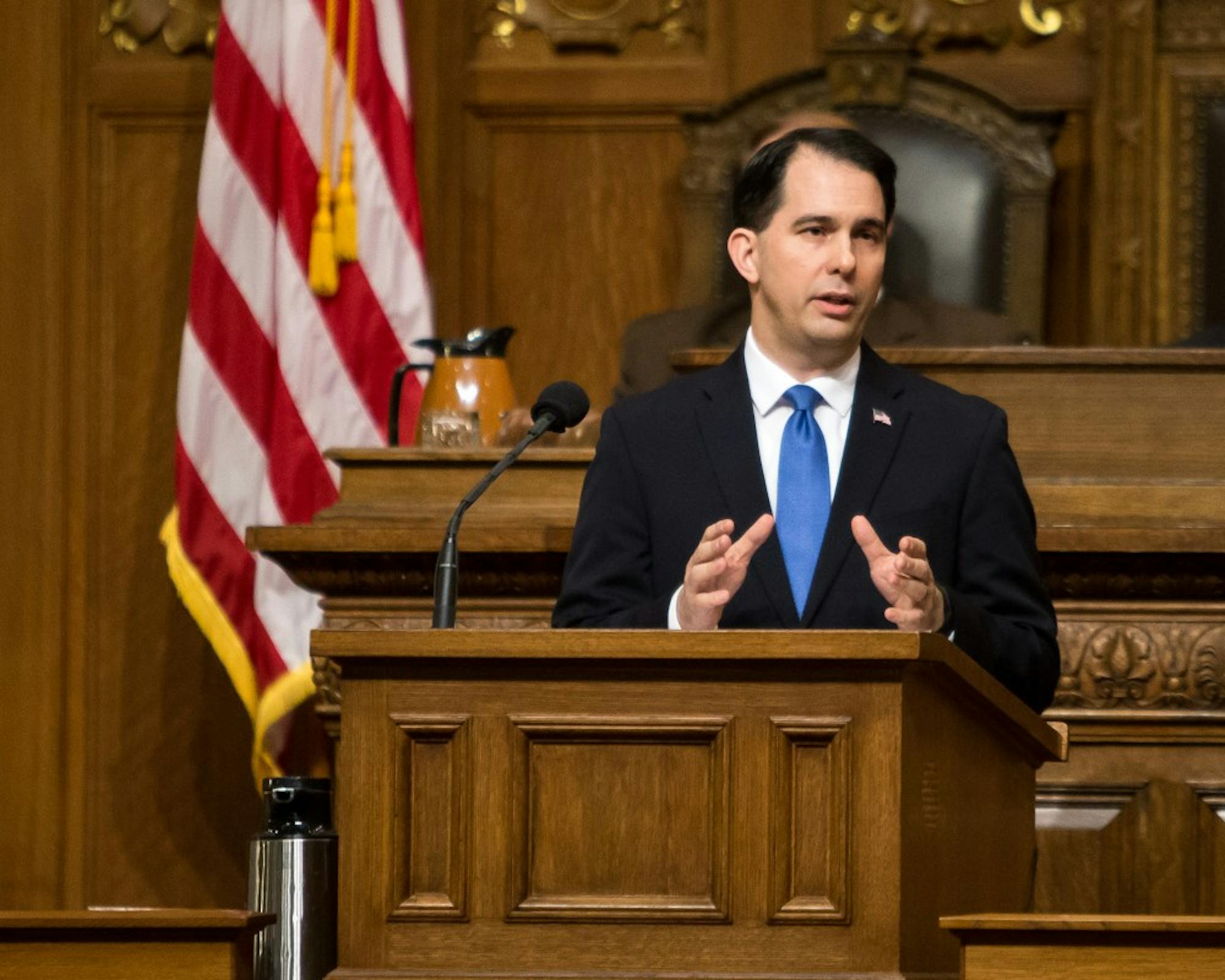 Gov. Scott Walker signed a pair of bills into law Thursday cutting funding for Planned Parenthood by roughly $8 million.