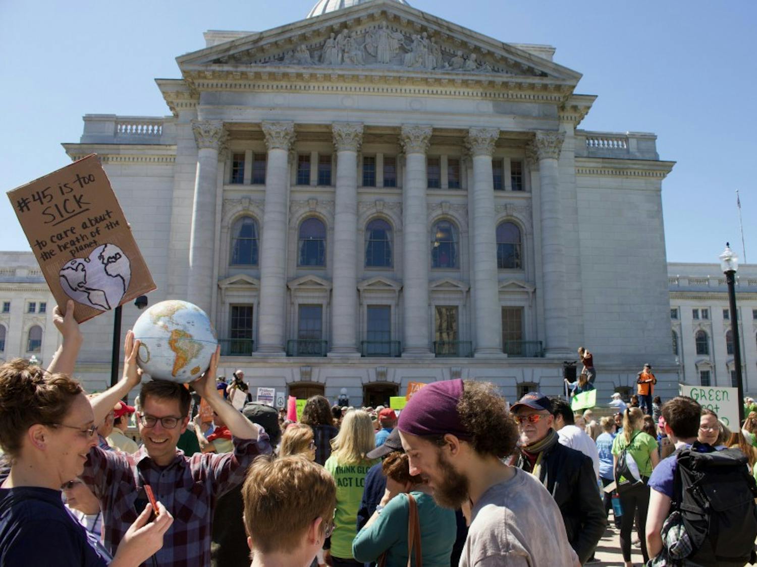  Thousands in Madison spent Earth Day marching from the state Capitol to Madison Gas and Electric, as part of an international movement to advocate for climate science and environmental protections.