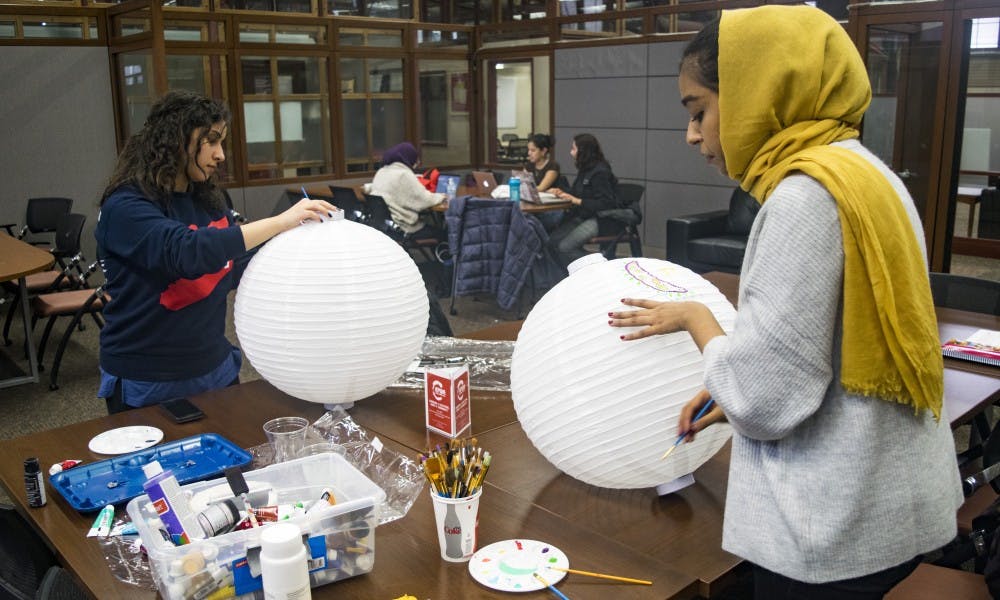 Students make lanterns in preparation for the&nbsp;Night Festival Wednesday at 5:30 p.m. in the Multicultural Student Center.
