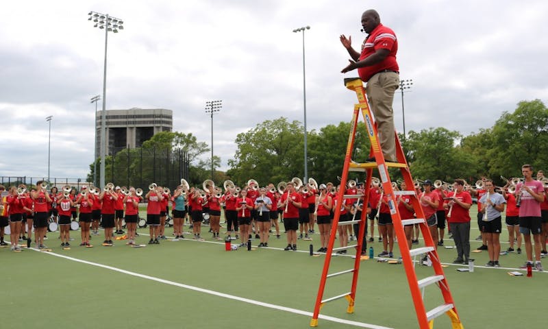 Corey Pompey and UW Marching Band members practice for the upcoming season.