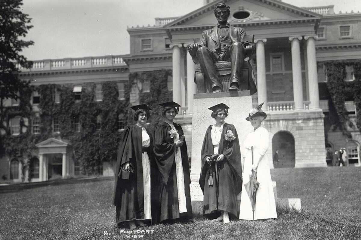 Women graduates stand in front of Bascom in a historical photo