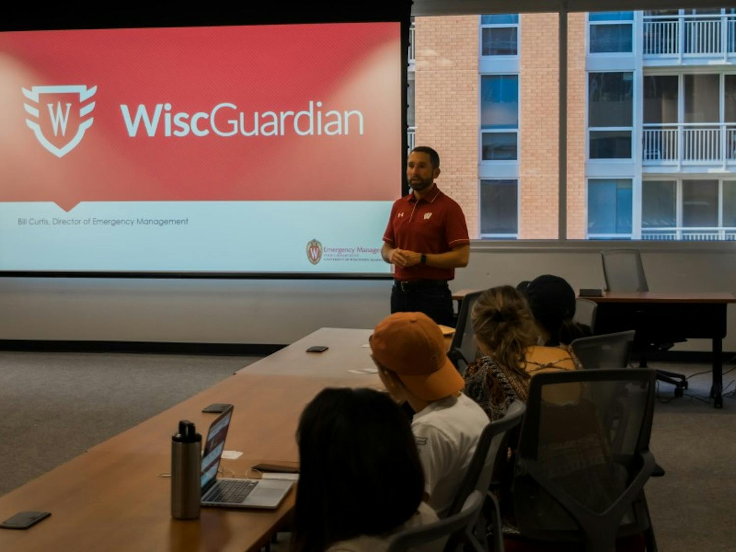 Bill Curtis, UWPD's emergency management director, spoke to members of the Associated Students of Madison's Shared Governance Committee Wednesday about the WiscGuardian app.