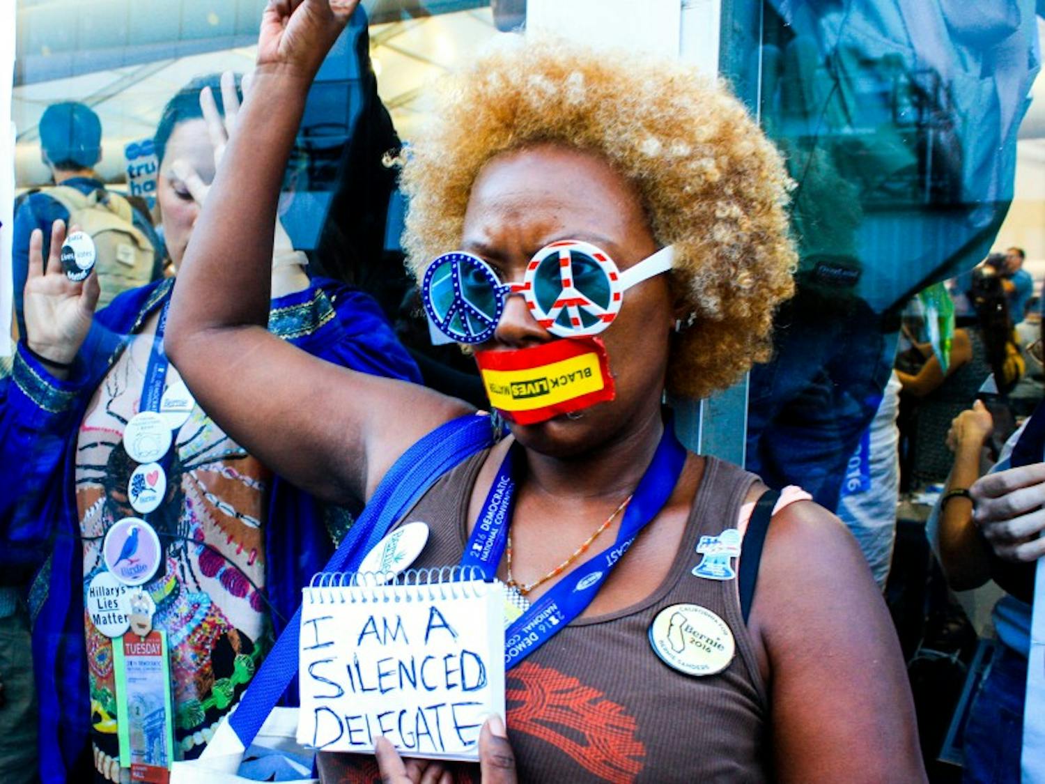 A delegate for Vermont Sen. Bernie Sanders demonstrates outside after Clinton secured the nomination.