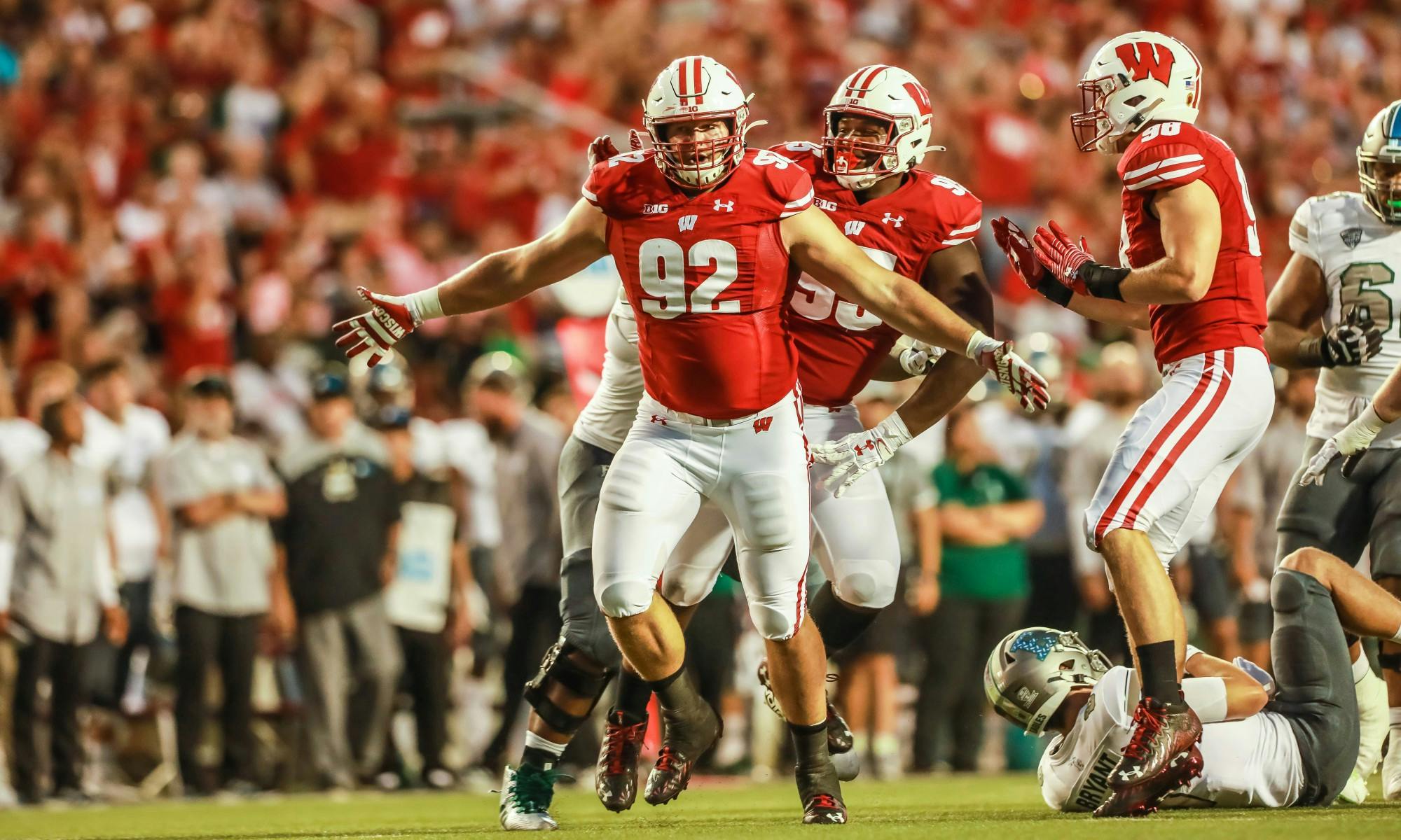 Photo of football player Matt Henningsen celebrating after a play.