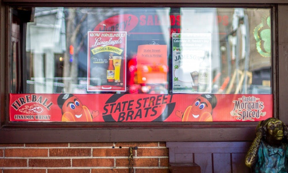 State Street Brats, one of five campus-area bars that posts a dress-code outside, bans customers from wearing plain white tees, baggy pants and do-rags.