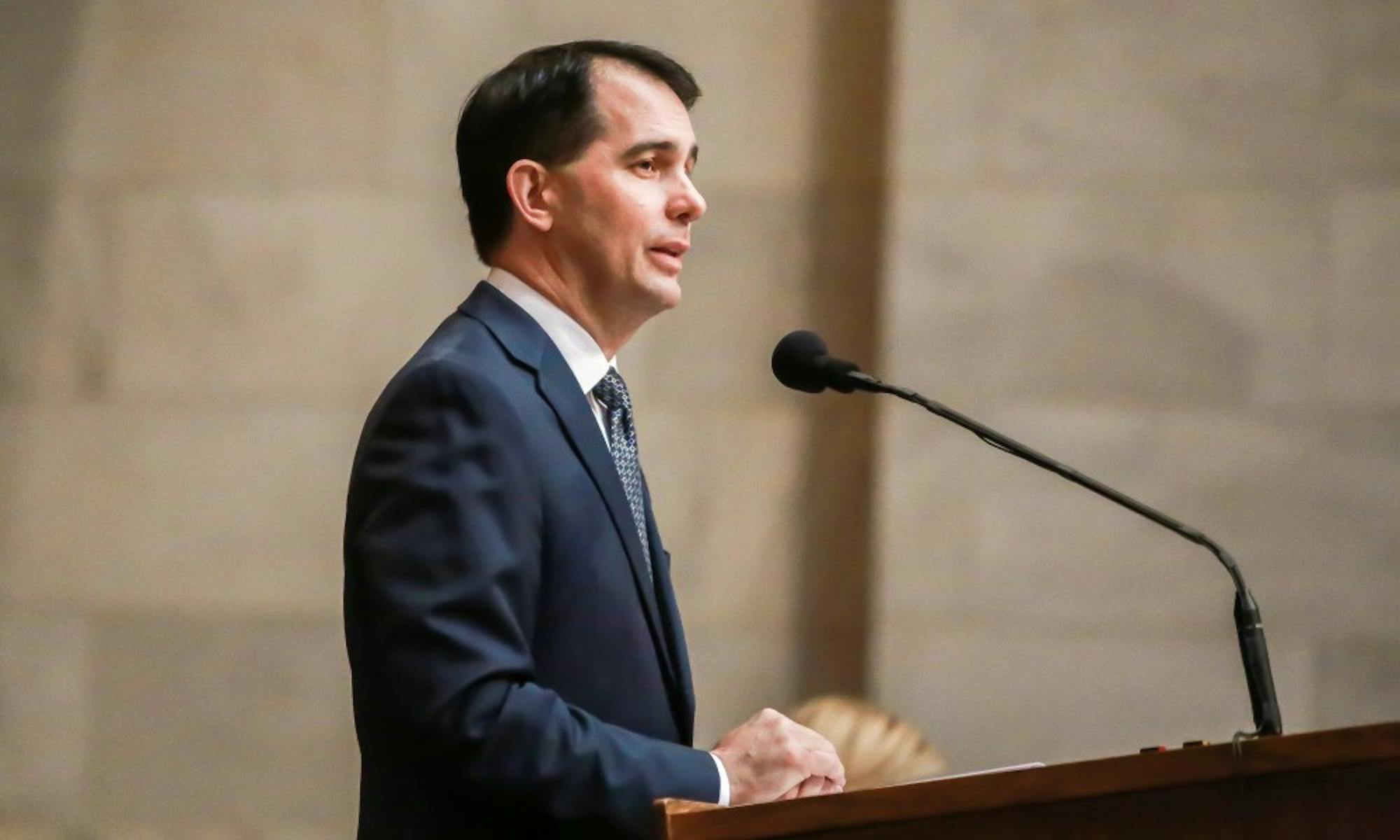 Gov. Scott Walker said he will cut tuition for in-state students at UW System schools.