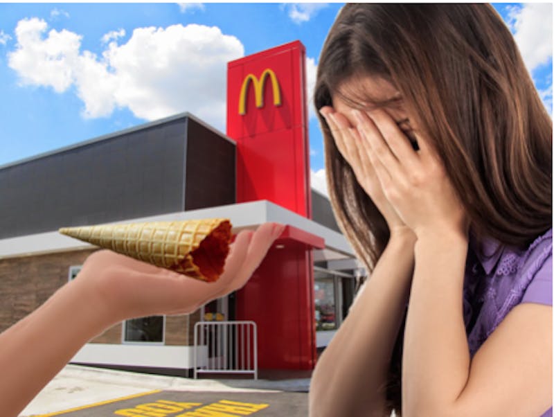 McDonald’s worker hands a dismayed woman the portion of a vanilla cone they are equipped to produce.