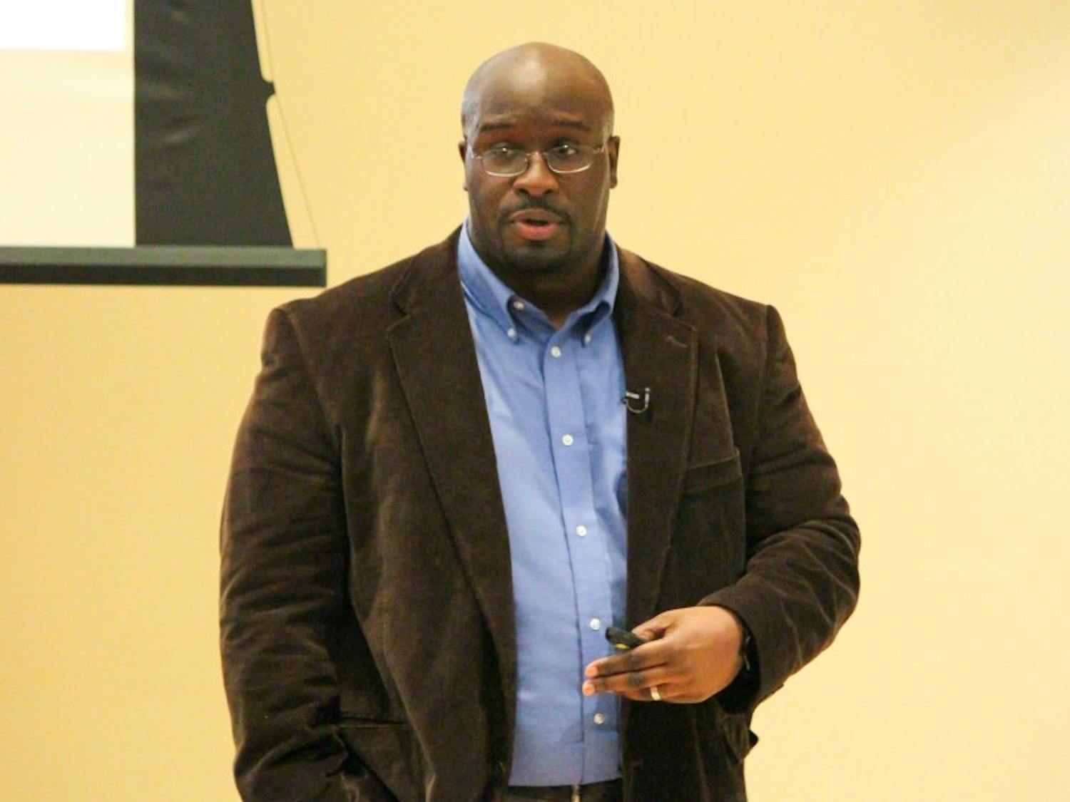 Jamein Cunningham of Portland State University discussed legal and racial relations in the 1960s and ’70s at Thursday’s Institute for Research on Poverty seminar.