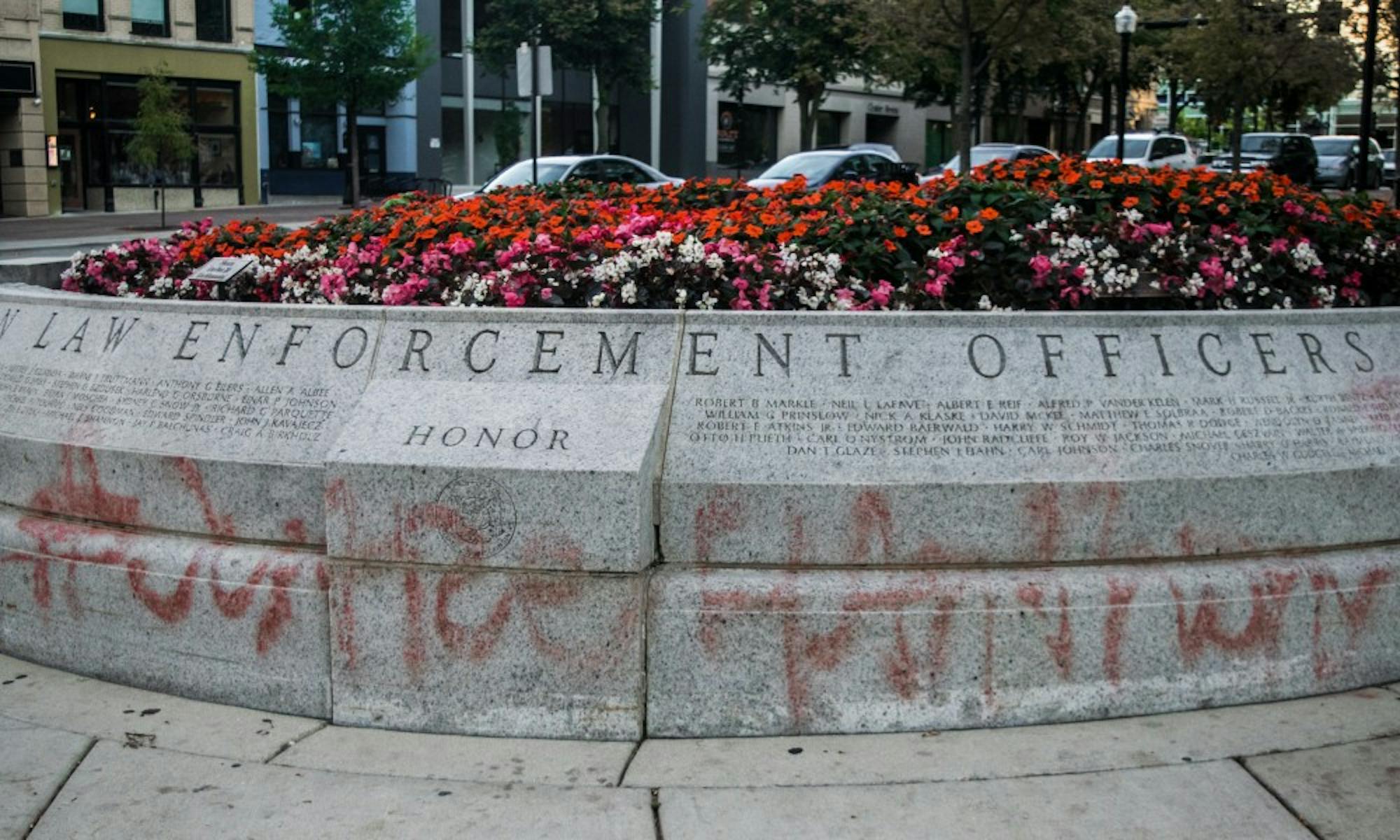 A memorial for fallen law enforcement officers was recently spray-painted with #Justice4AnthonySmith.