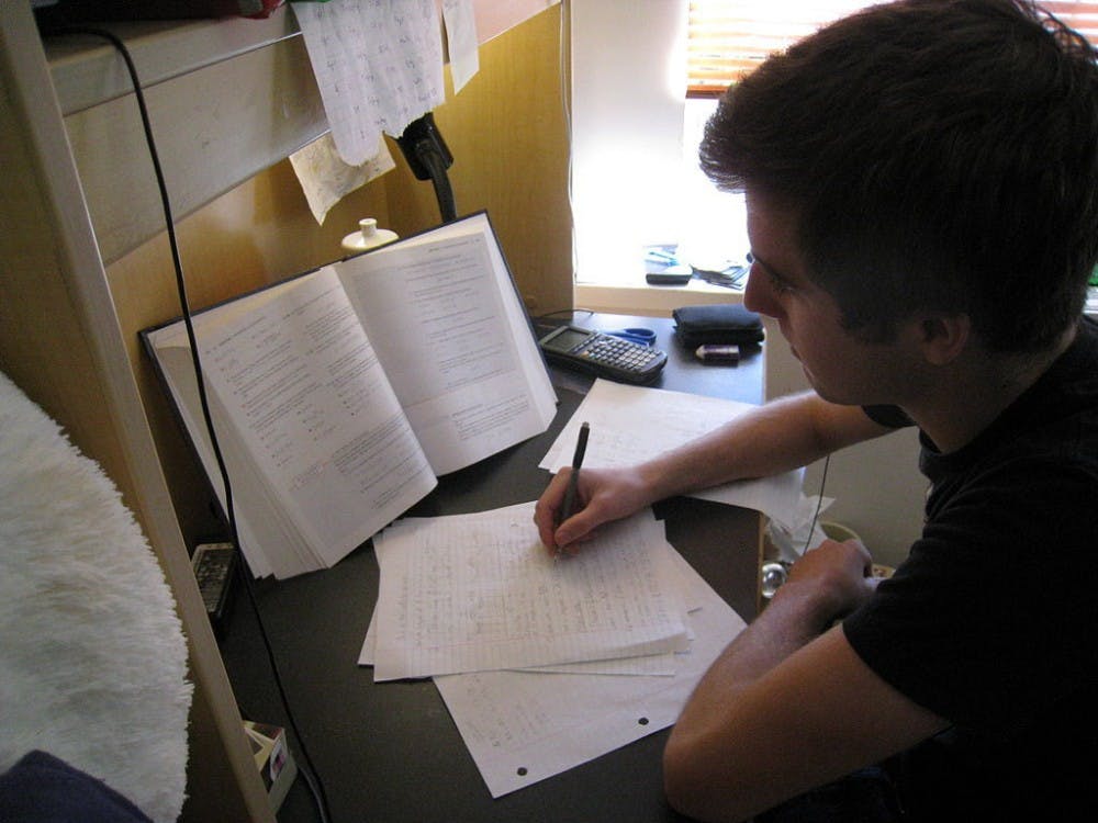 Drew Boyd completing basketball team's homework