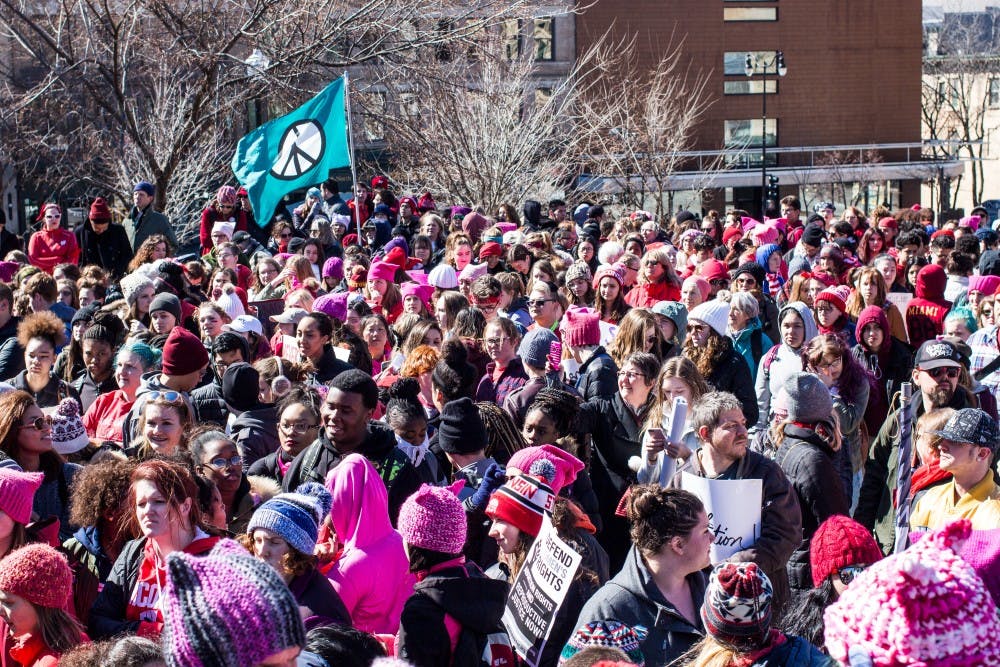 Hundreds of protesters swarmed the Capitol Wednesday to voice support for the rights of women and other marginalized people.