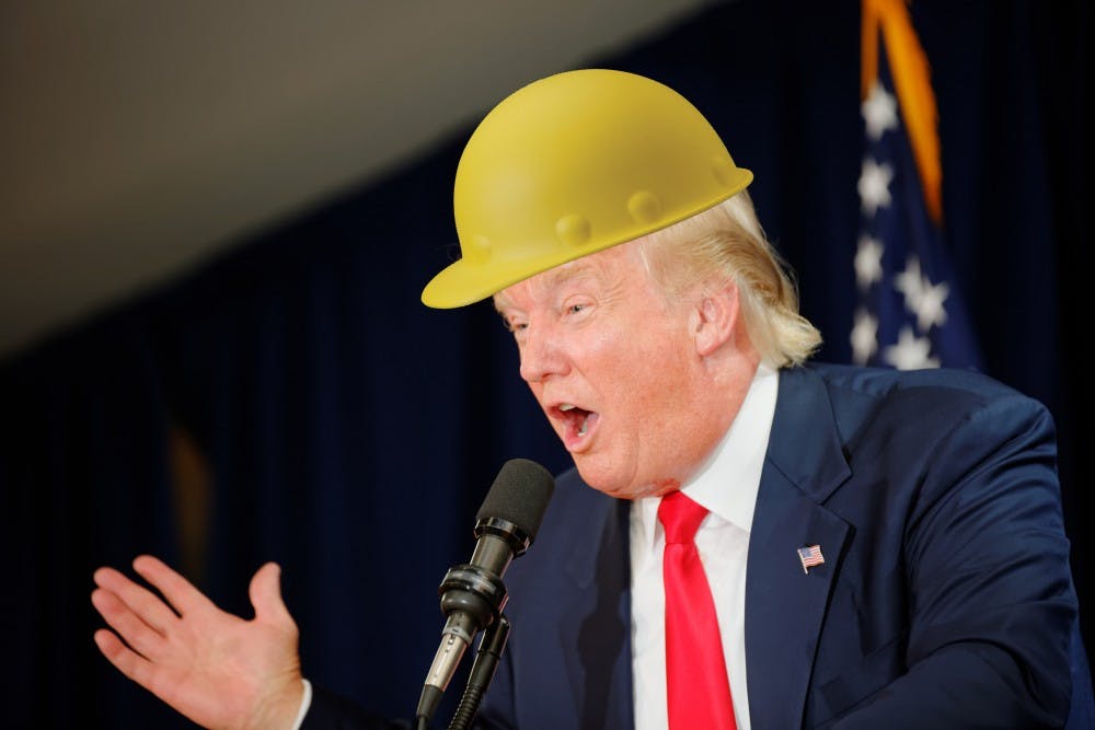 Trump forgot to remove his helmet after appraising a gold mine.