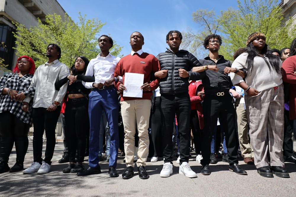 Students are photographed silently protesting on Library Mall on the University of Wisconsin-Madison campus on May 3, 2023. The students linked arms and protested in silence against UW-Madison's inaction after a video showing a white UW-Madison student using racial slurs circulated online.
