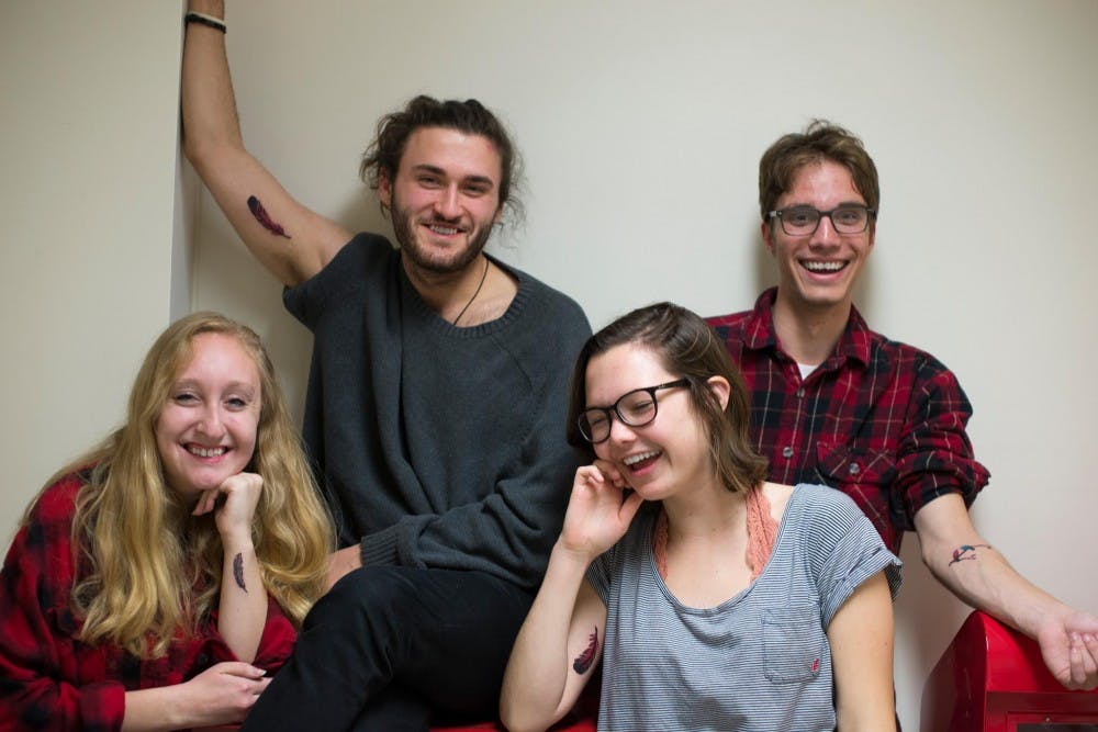 The Daily Cardinal staff members (from left to right) Madeline Heim, Peter Coutu, Sammy Gibbons and Andrew Bahl got their tattoos about four months ago.&nbsp;
