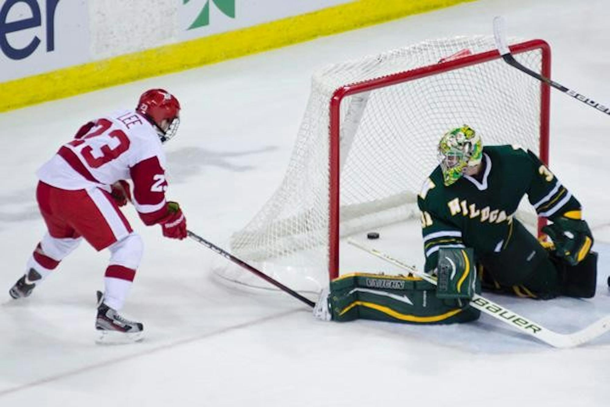 Badgers split with NMU to open year