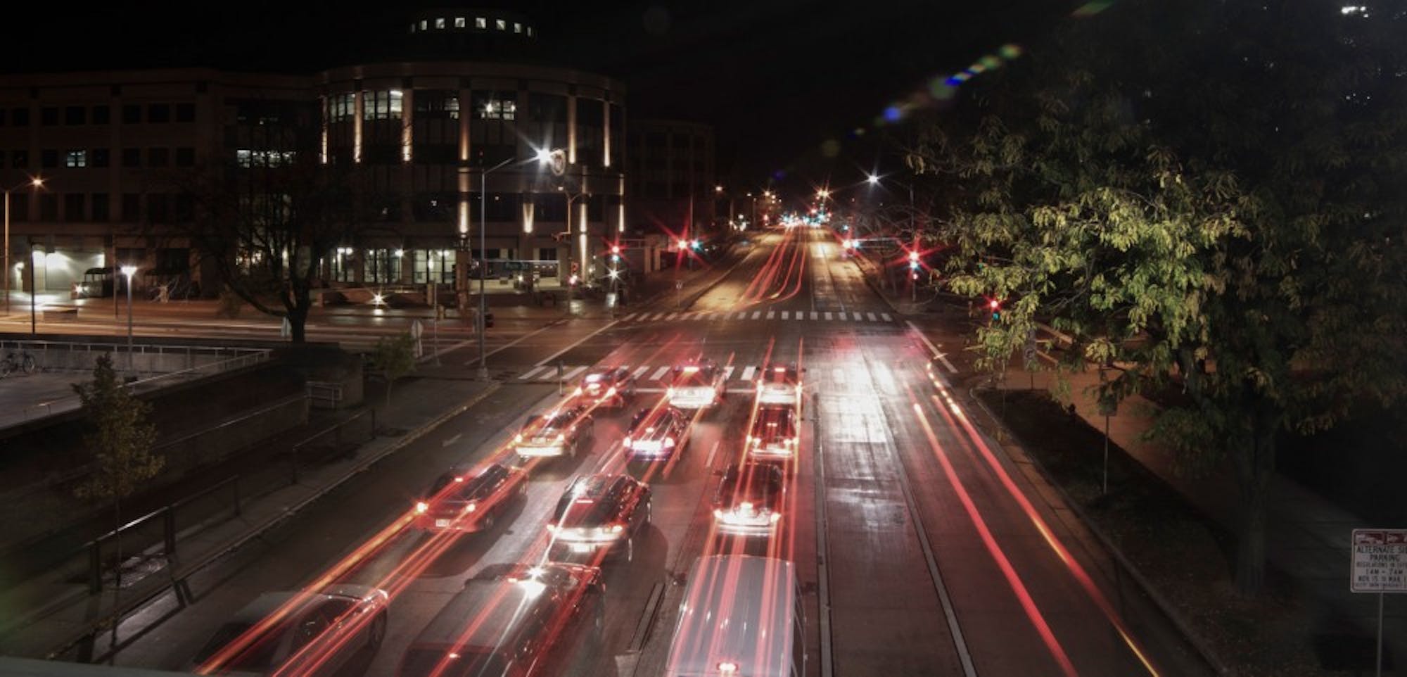 Cars headed west down University Avenue at the intersection of Park Street and University Avenue under long exposure, taken from the pedestrian footbridge.