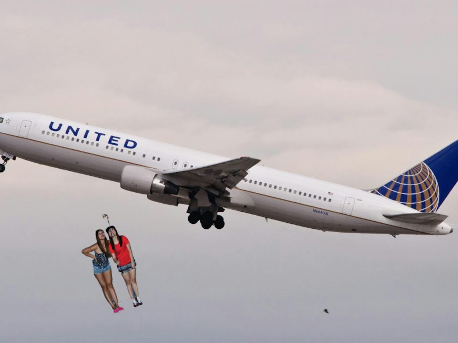 Two girls pause to take a selfie as they plunge to their untimely deaths.